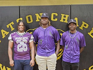 Three Watson Chapel seniors signed with Arkansas Baptist to play college sports Thursday. L to R: Eddie Johnson, Demarrion Kye, Alcarlos Mack. (Pine Bluff Commercial/Tanner Spearman)